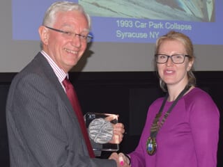 John Broomfield receiving the Paul McIntyre Award from Sarah Vasey.