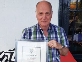 Alan Denney receiving an Award